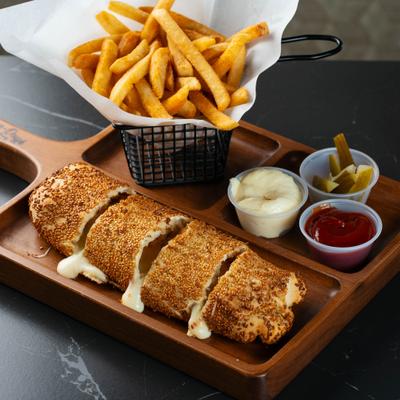 Sesame-crusted cheese bread with fries, pickles, mayo, and ketchup.