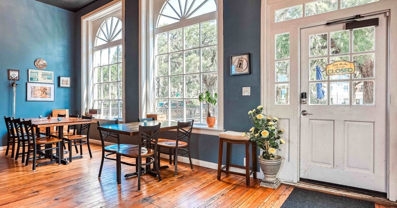 Interior, seating place with tables and chairs near windows