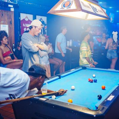 Guests playing pool.