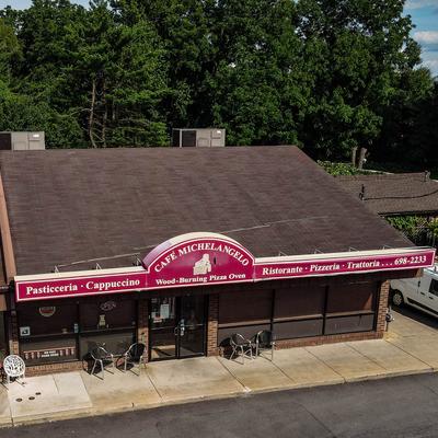 Drone shot of the cafe building, front side.