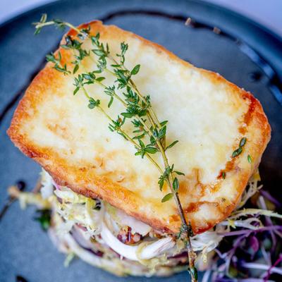 Fried halloumi cheese topped with thyme.