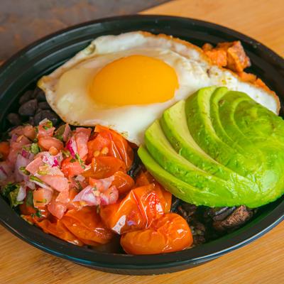 Power Bowl, with quinoa, tomatoes, mushrooms, egg, sweet potato, beans, pico, and avocado.