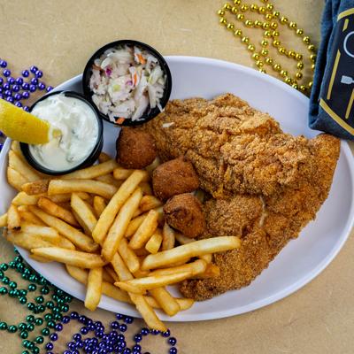 Fried Catfish served with fries, hush puppies, coleslaw and a dipping sauce.