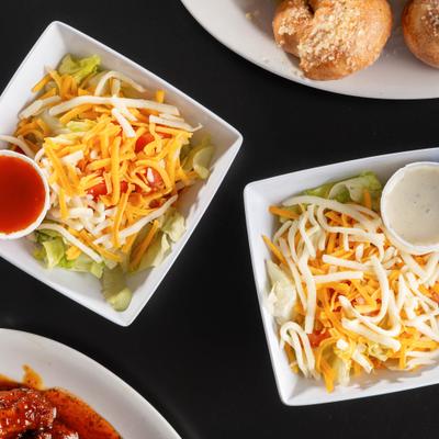 Side salads with dressing.