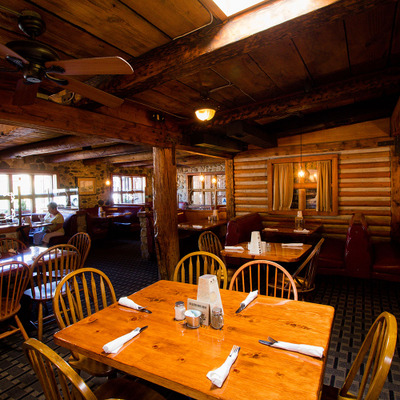 Interior, seating area, wood, tables and chairs, cozy atmosphere