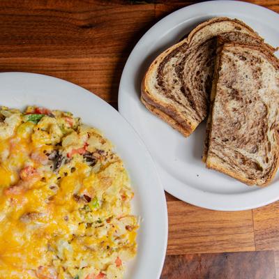 Vegetable scramble served with tea and rye bread.