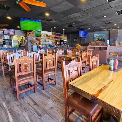 Interior, dining area, TV on the wall