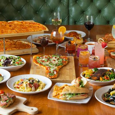 Table spread with assorted dishes and drinks.