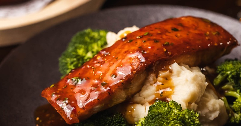 Bourbon Salmon served over mashed potatoes with broccoli