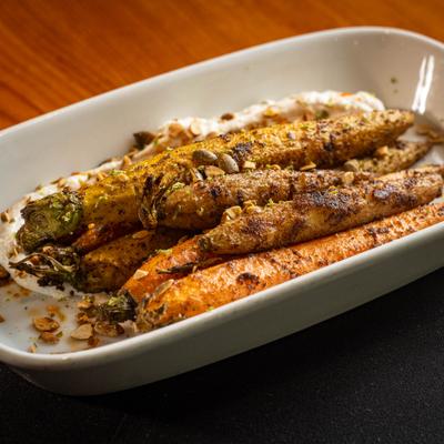 Roasted carrots, served, top view, closeup