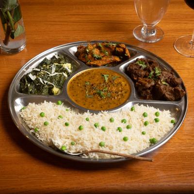 Rice with assorted meats or vegetables & lentils, pickle, yogurt & dessert.