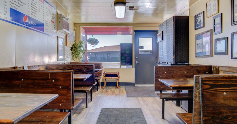 Interior, tables and wooden benches ready for guests