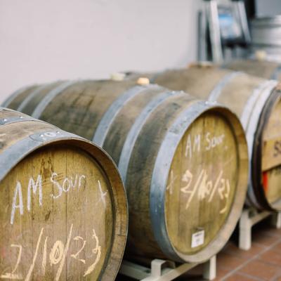 Wooden barrels marked with chalk.