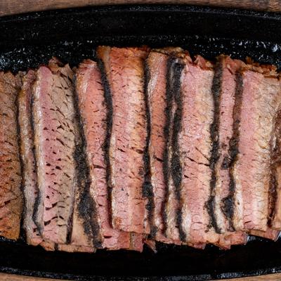 Plte of sliced Smoked Brisket, top view.