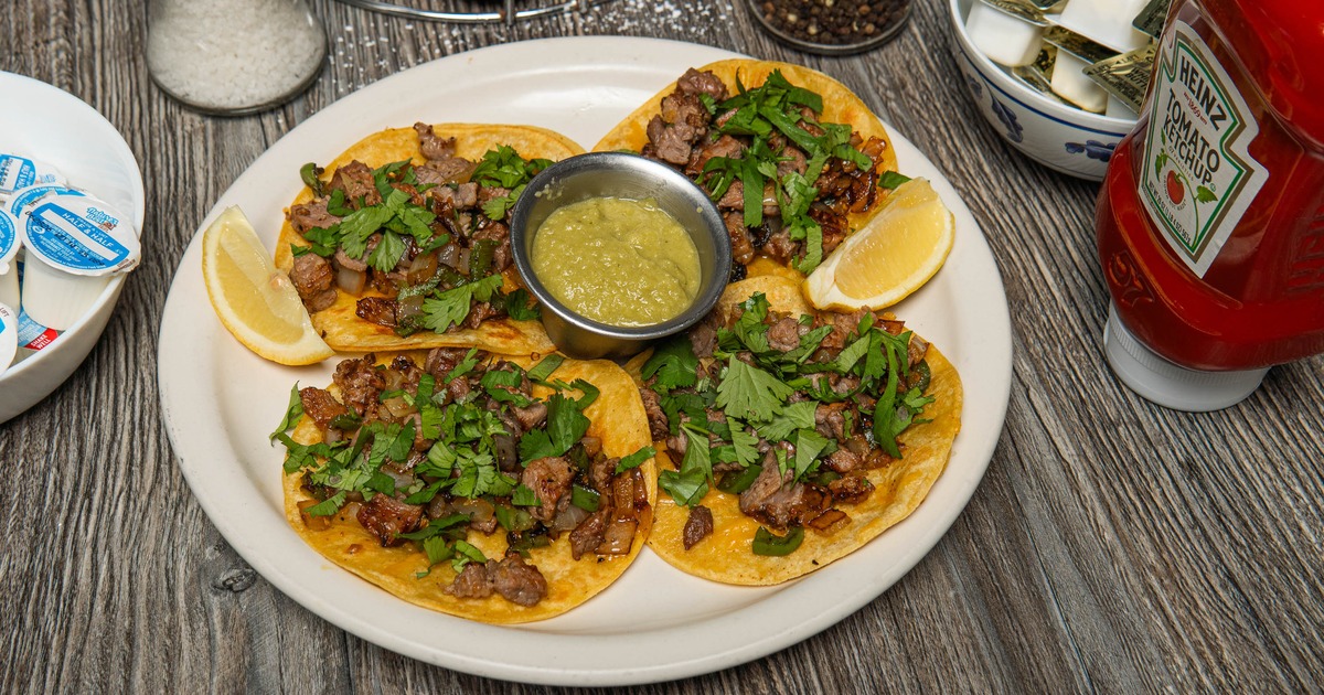 Street tacos paired with green salsa