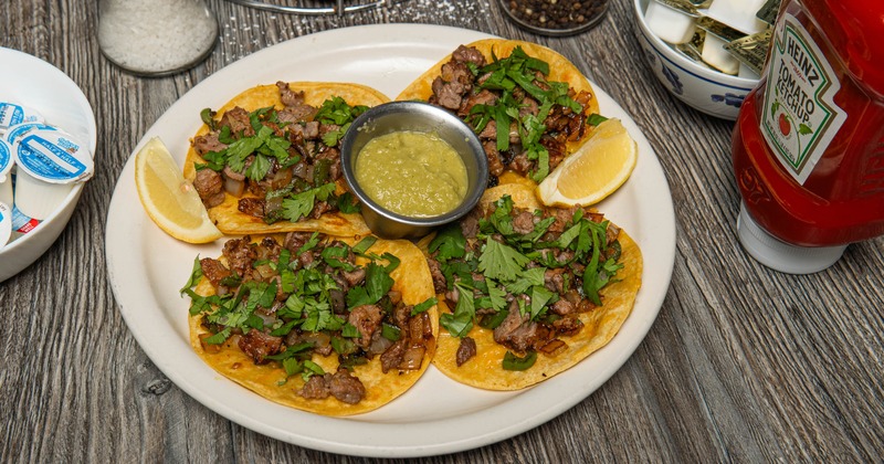 Street tacos paired with green salsa