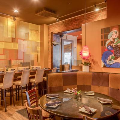 Restaurant dining area, fully set tables.