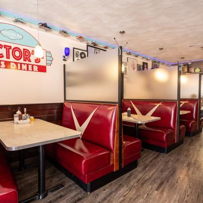 Dining area, red vinyl booths and tables.
