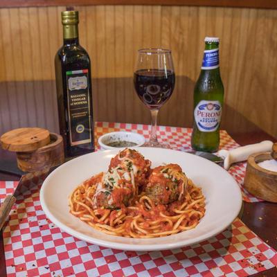 Meatballs and spaghetti served with wine, beer, balsamic vinegar, and spices.