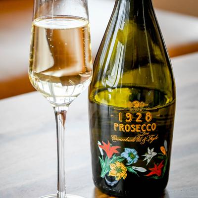 Bottle and glass of Prosecco.