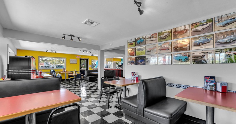 Interior seating area with chairs, tables and booths