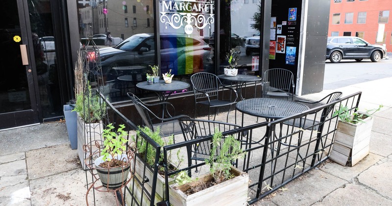 Exterior, tables and chairs near entrance