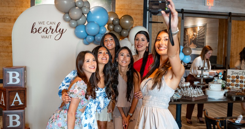 Interior, tables and chairs with pictures in the back