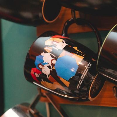 A cup for coffee with Friends TV show print on it.