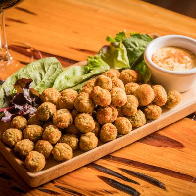 Stuffed fried olives and roasted garlic aioli sauce