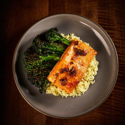 Apricot-jalapeno glazed salmon served with  duck fat pilaf and broccolini.