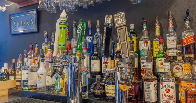 Various liquor bottles and beer taps