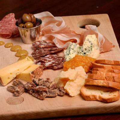 Chef's selection of cured meats served with house-made crostini and accompaniments