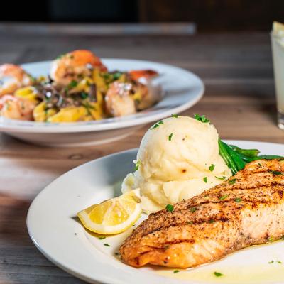 Grilled salmon with mashed potatoes, and shrimp Pappardelle with mushrooms