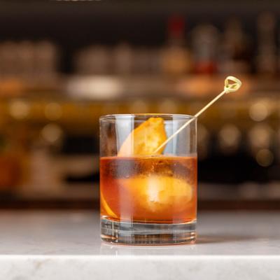 Old Fashioned cocktail on a marble counter.