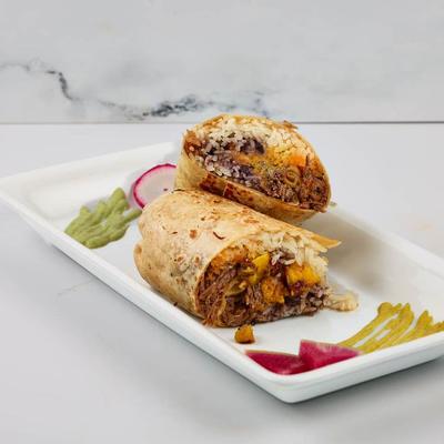 Burrito sliced in half and served.