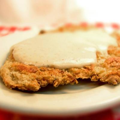 Chicken Fried chicken topped with gravy.