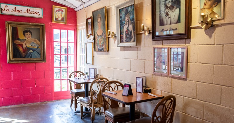 Interior, tables and chairs with windows behind