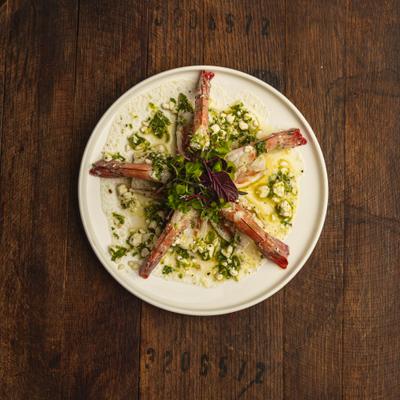 Poached prawns with mint, feta cheese, lime juice, olive oil, lime zest, and microgreens.
