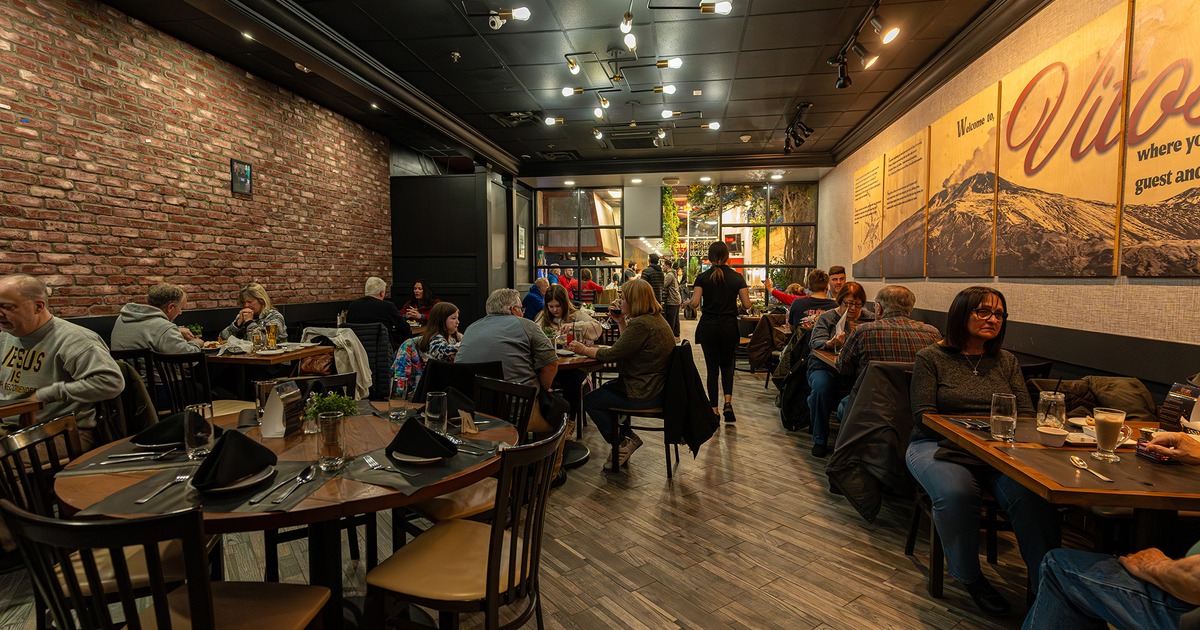 Interior space, dining area full of guests enjoying their food and drinks
