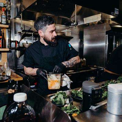 Kitchen staff preparing salads.