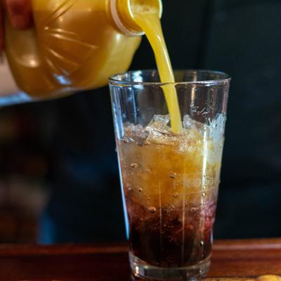 Bartender pouring a drink.