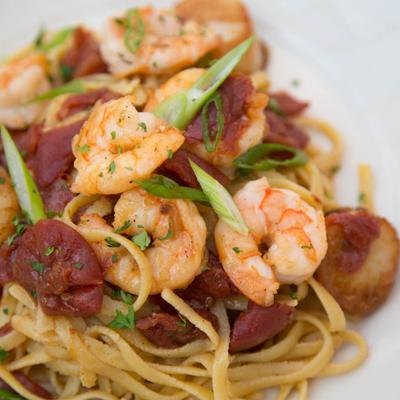 Linguine pasta with shrimp and tomatoes.