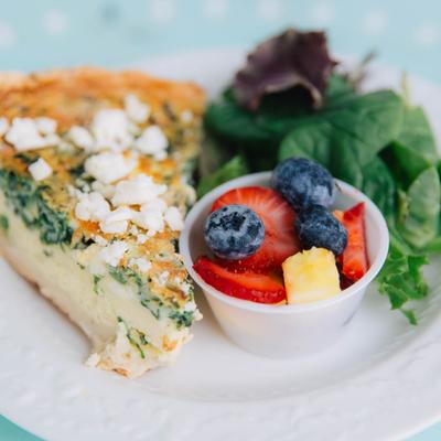 Spinach and feta quiche, served with fresh fruit