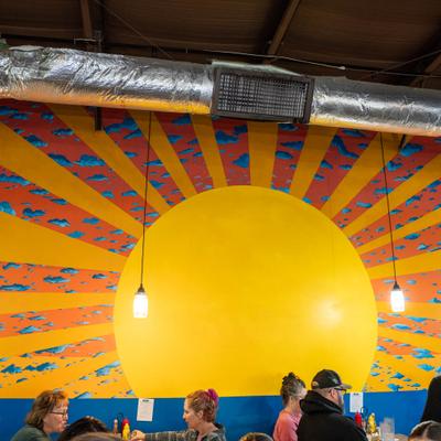Sunburst mural in dining room.