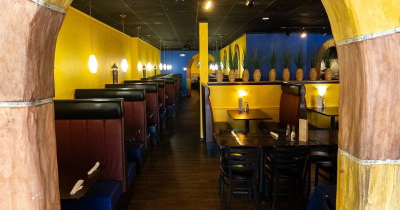Interior, view of the dining room through the arched  door