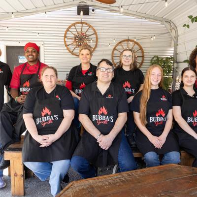 Staff members posing on the patio.