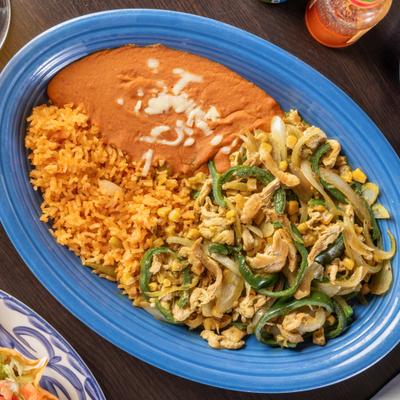 Pollo Poblano with sides of rice and beans.