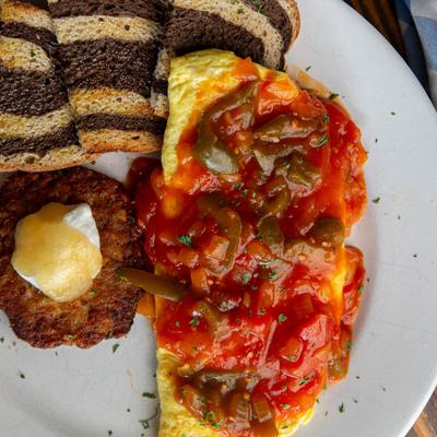 Spanish Omelette served with potato pancake and marble rye toast