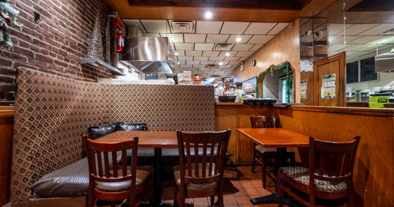 Interior, dining area with chairs, tables and restaurant booth