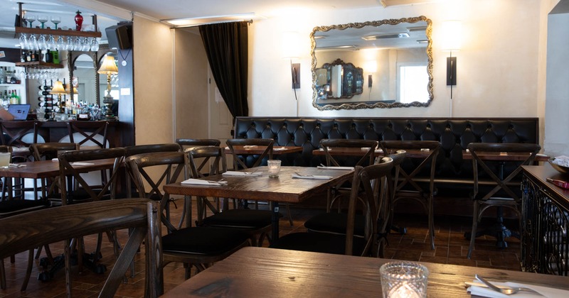 Interior, wooden tables and chairs ready for guests